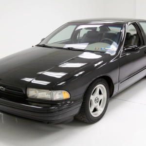 a black car in a white room