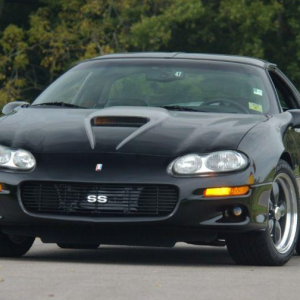 a black sports car parked on a road